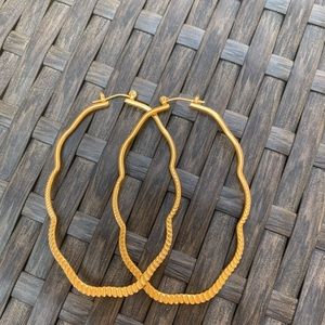 Gold hoop earrings with lever closure